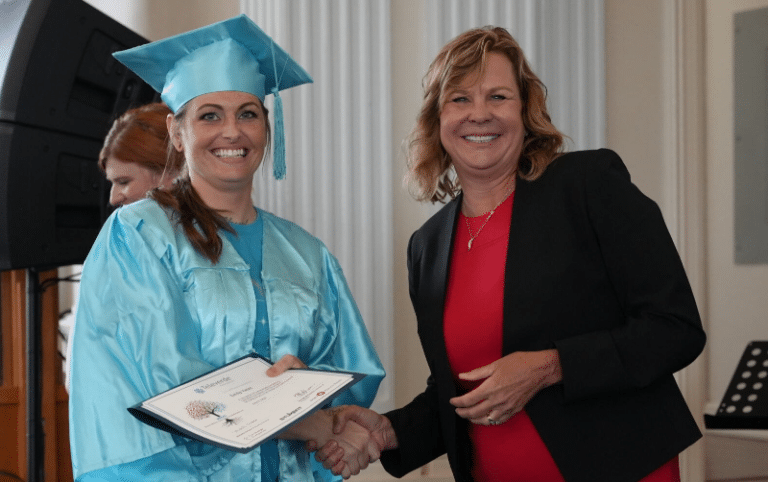 Michelle Cirocco shaking hands with a Summer 2024 Televerde Foundation PATHS graduate