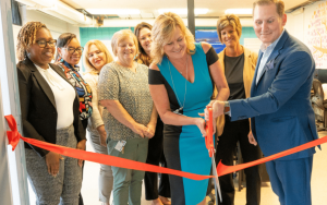 Michelle Cirocco cutting the ribbon at a new PATHS class